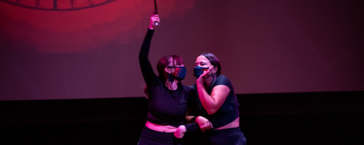Two students performing on stage
