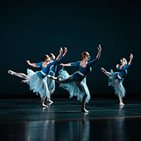 Four dancers on stage.