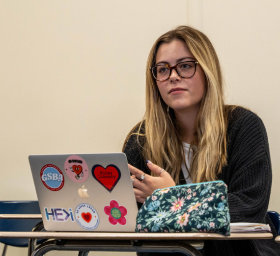 A student at their computer in class. 