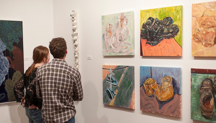 Community members enjoy Gonzaga artwork at the Senior Art Show at Richmond Art Collective on Friday, April 8th, 2017.