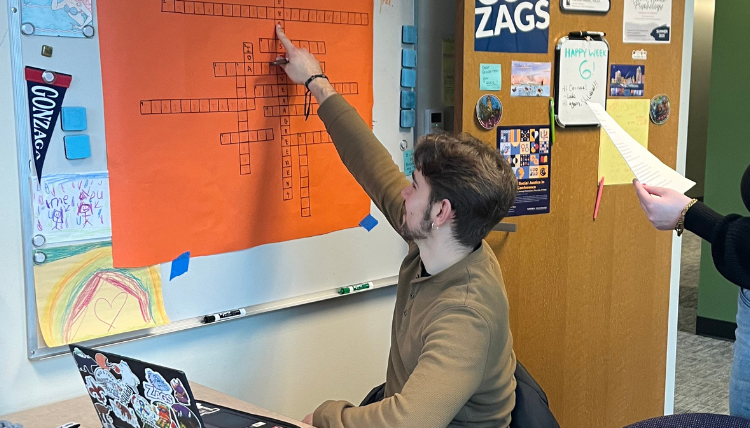 Special Education student works on crossword puzzle as a review game