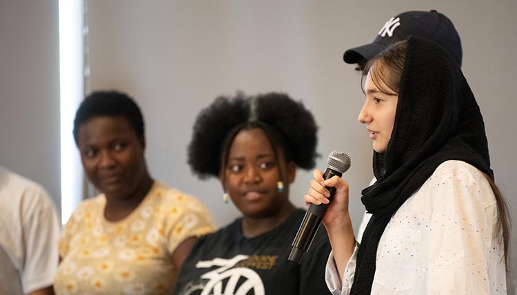 Teens presenting in front of classroom