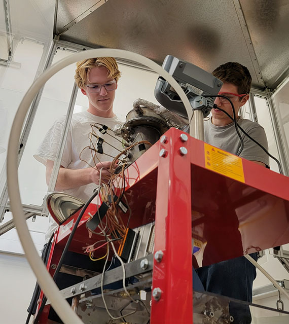 Students working in combustion lab
