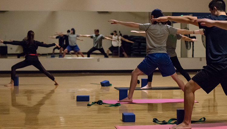 GU students participating in a yoga class