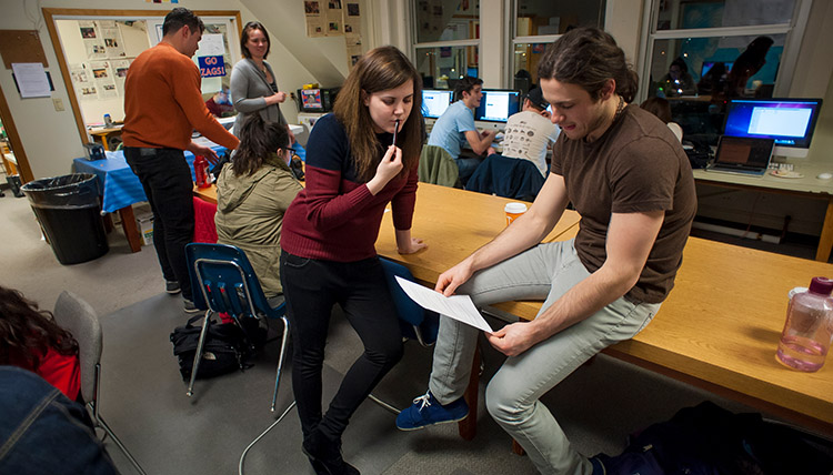 Bulletin page editors review copy changes before the newspaper goes to press.