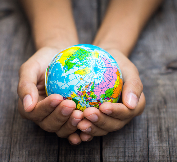 Hands holding a n Earth Globe