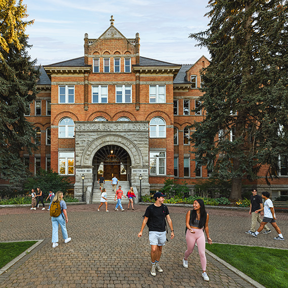 Students walk in front of Gonzaga's College Hall