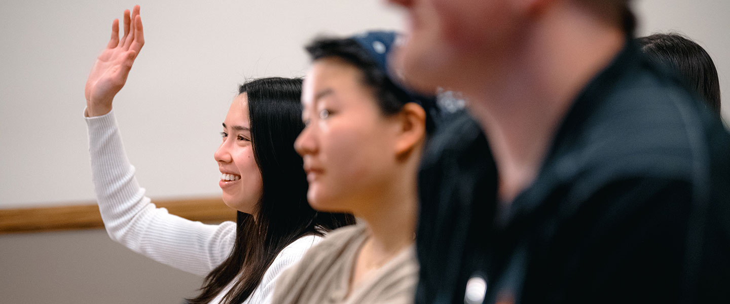 Student raising hand.