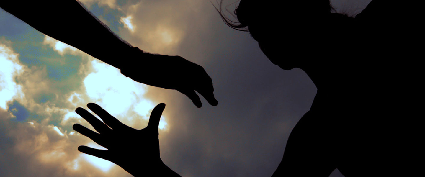 Two people about to clasp hands