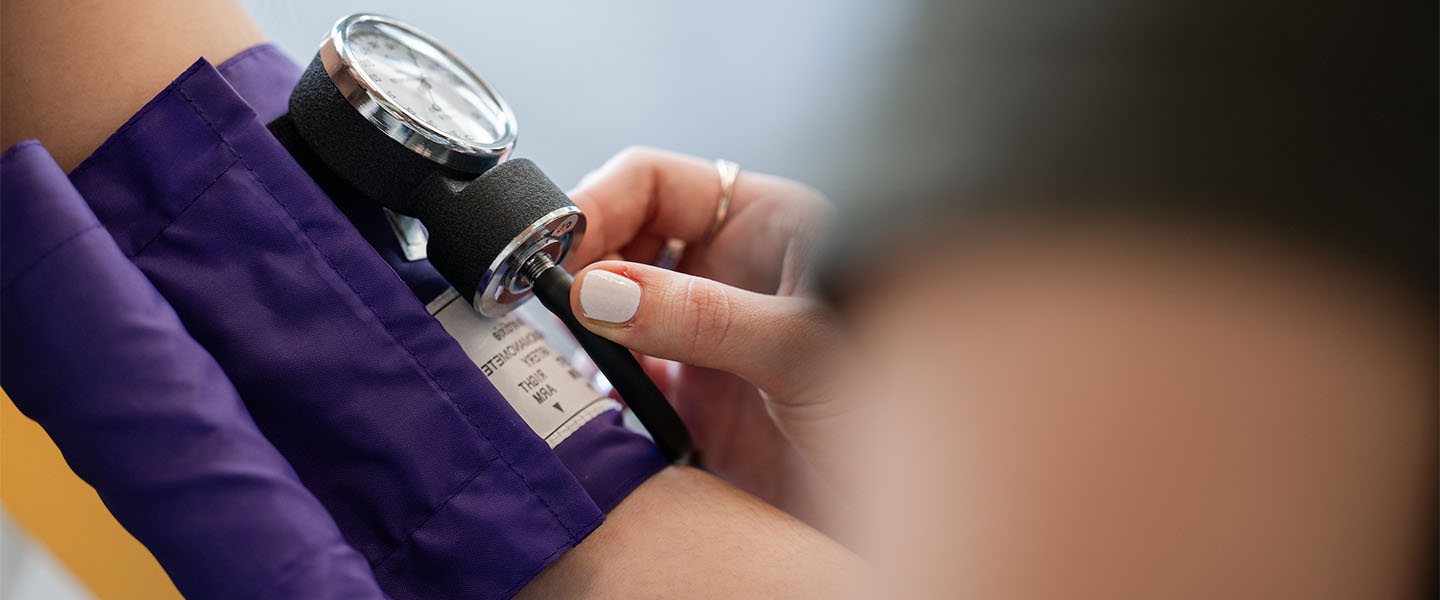Patient getting their blood pressure measured