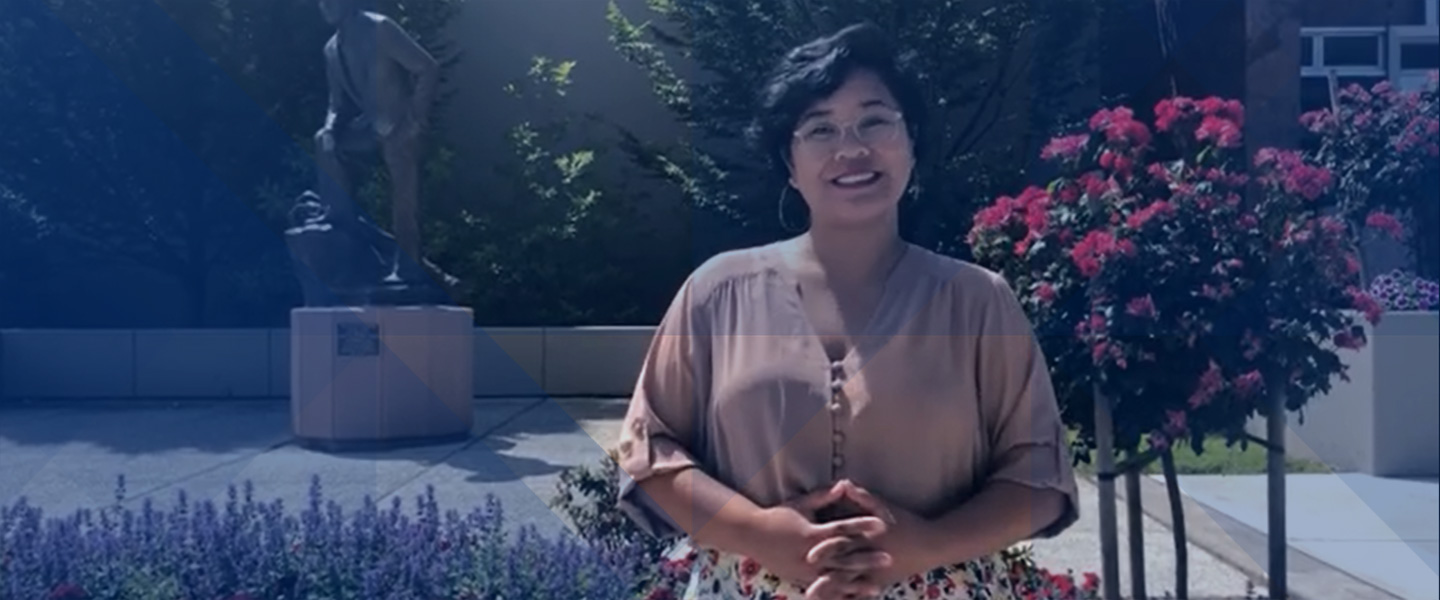 Psychology major Isabella greets viewers