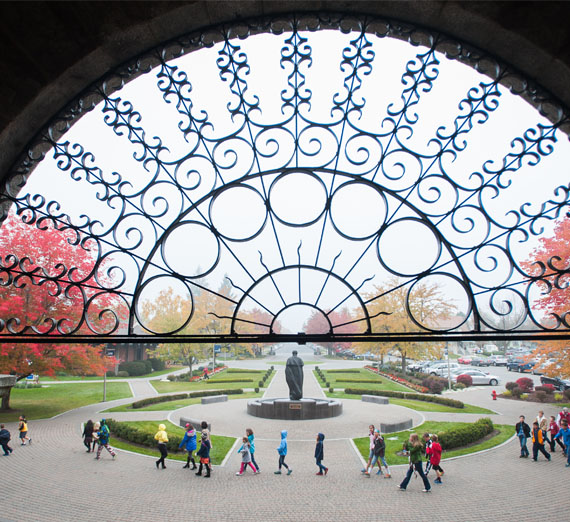 kids walk in front of college hall 