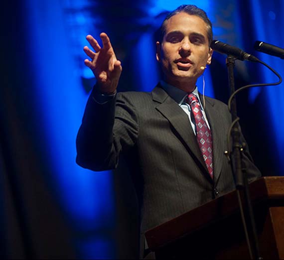 Siddharth Kara speaking to an audience.