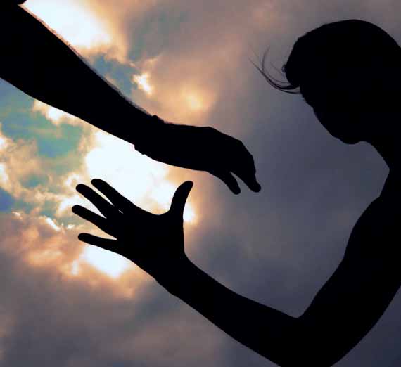 Two people about to clasp hands