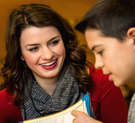 Gonzaga University student Madison Rose mentoring a middle school student