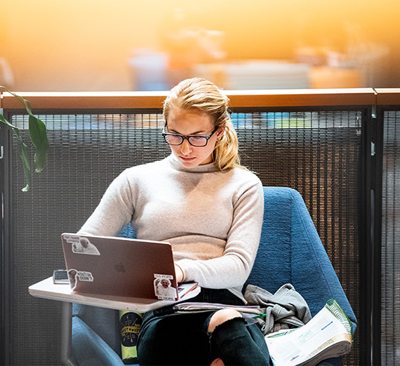 student working on a laptop