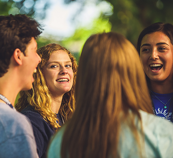 Student shares with a small group her experience with undegraduate research.