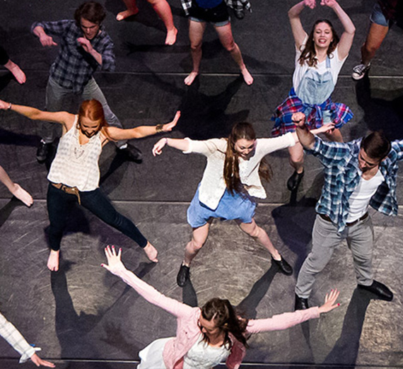 Theatre students on stage dancing