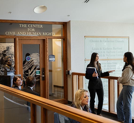 two people masked walked on campus in fall