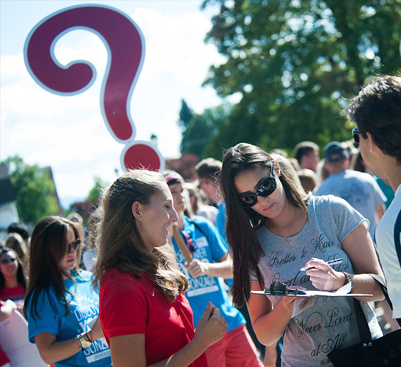 Students in crowd with questionmark