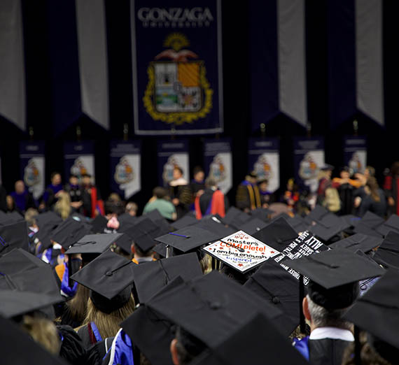 Graduates sitting during commencement. 