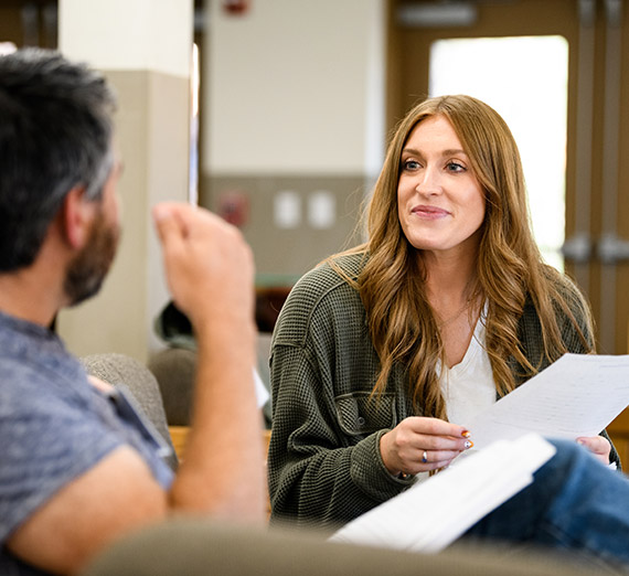 Two students enrolled in a Gonzaga certificate program have a discussion.