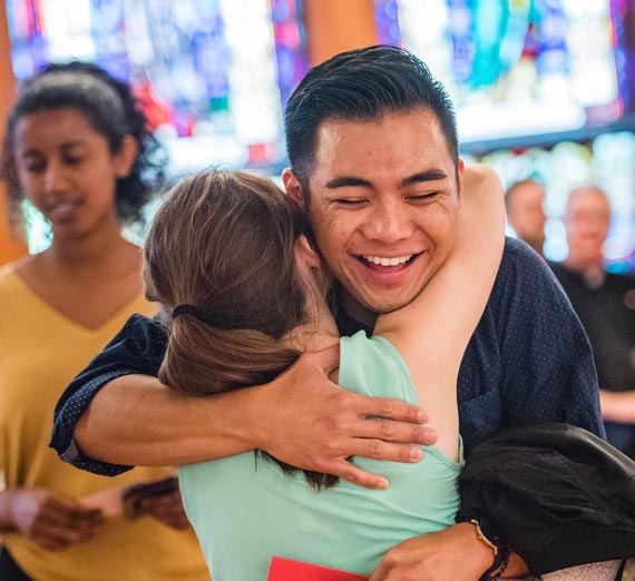 Students hugging at Gonzaga University Social Justice Missioning ceremony, 2018