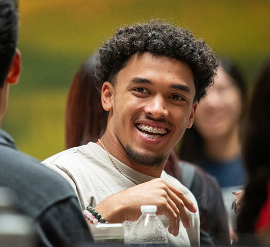 Students chat over a meal in the COG