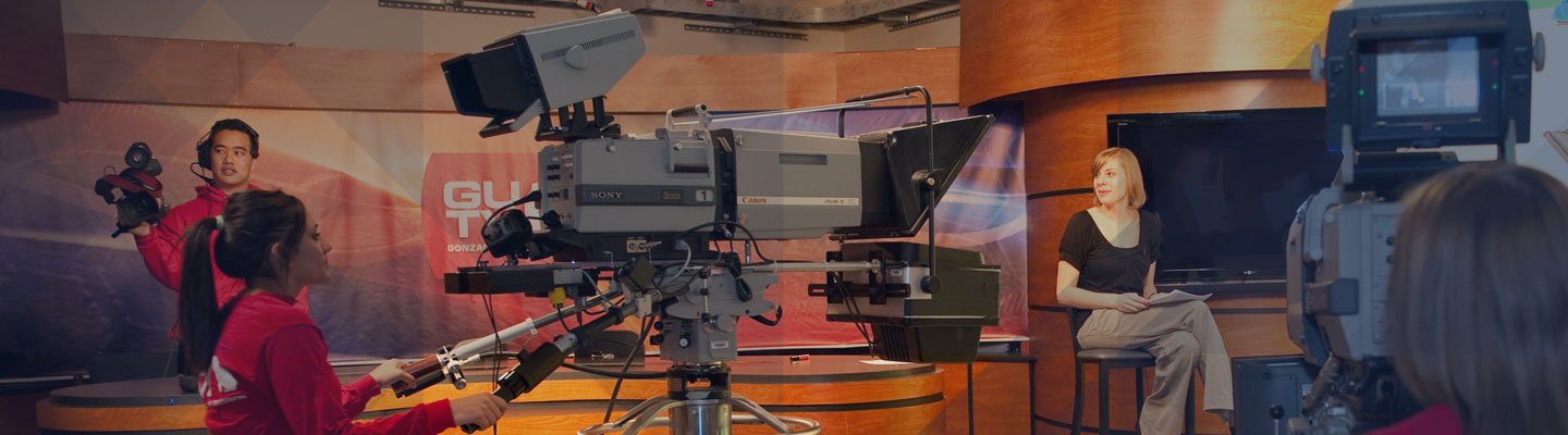 Students prepare to film a GUTS segment for GUTV