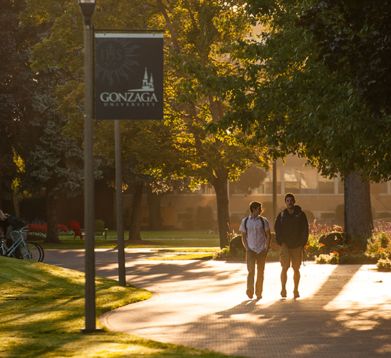 Students walking on campus on a sunny day