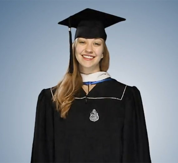 Studemt dressed in graduate regalia.