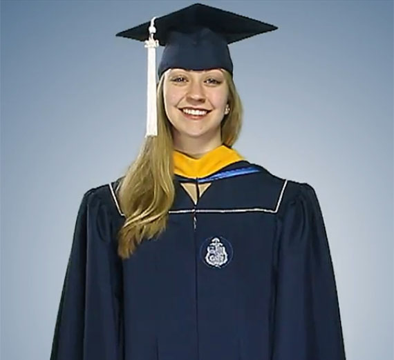 Studemt dressed in undergraduate regalia.