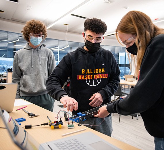 Students study robotics in the Innovation Studio, an open STEM space designed to foster collaboration.
