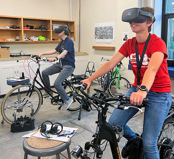 virtual reality headsets for students on stationary bicycles