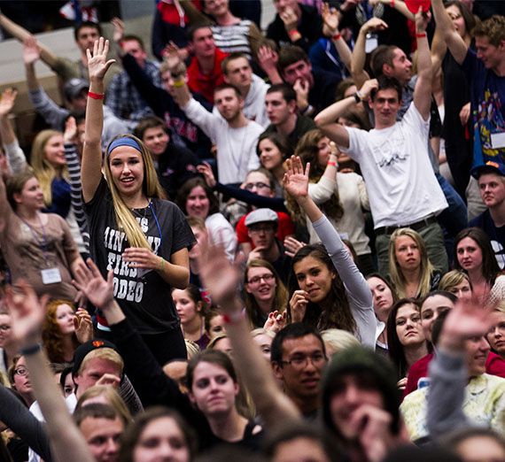 Excited crowd in bleachers during GEL Weekend.