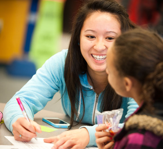 A student is mentoring peers.