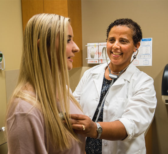 student getting checkup at health center 