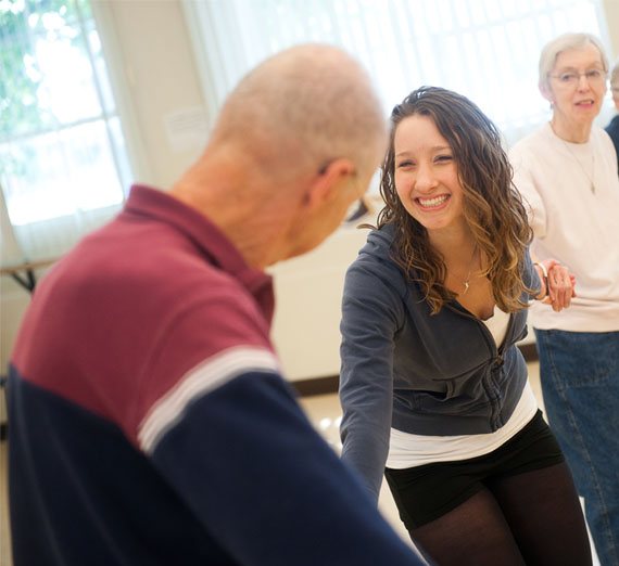 student volunteering at parkinsons dance class