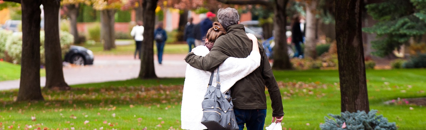 Walking and hugging during Fall Family Weekend.