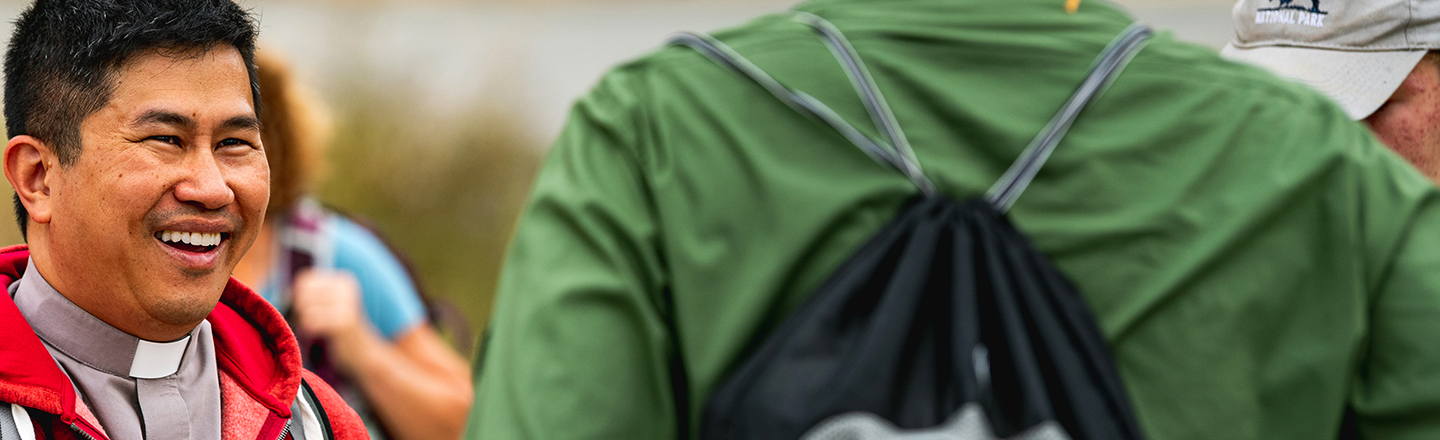 Father Bryan Pham, Gonzaga's law school chaplain, meets with students.