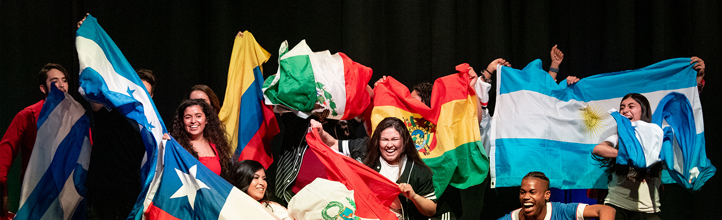 Students present flags at the La Raza festival.