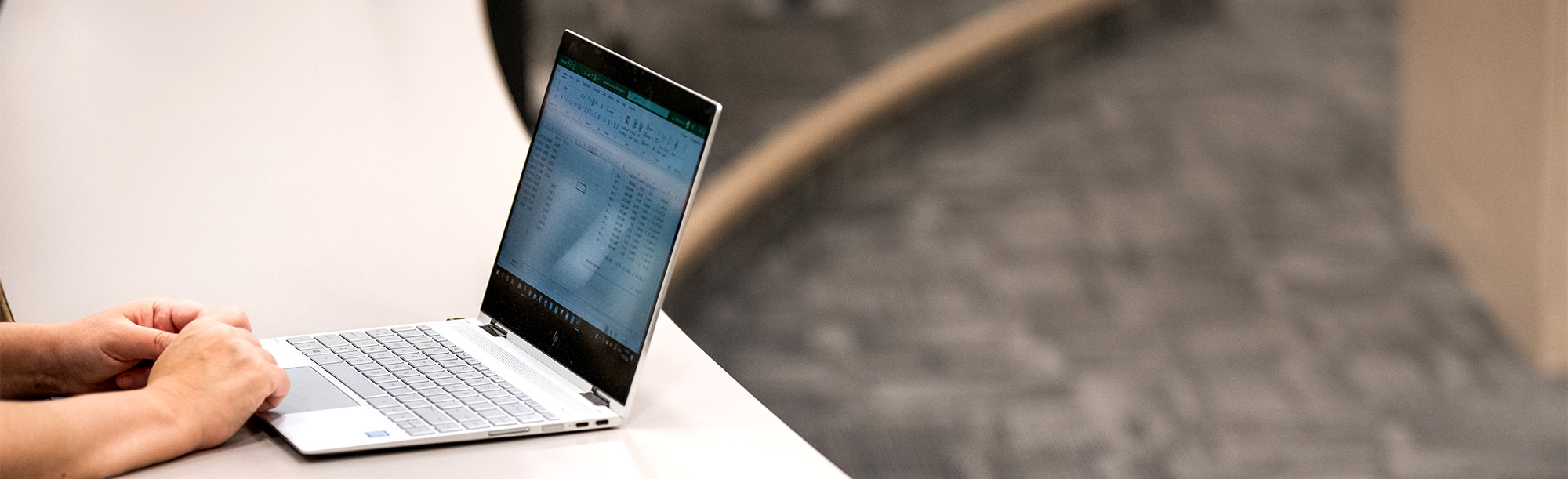 close up of hands at laptop