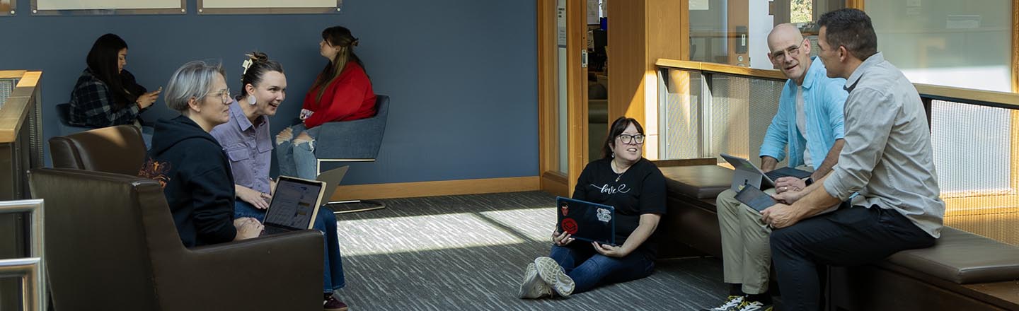 Small group of students meet to discuss project