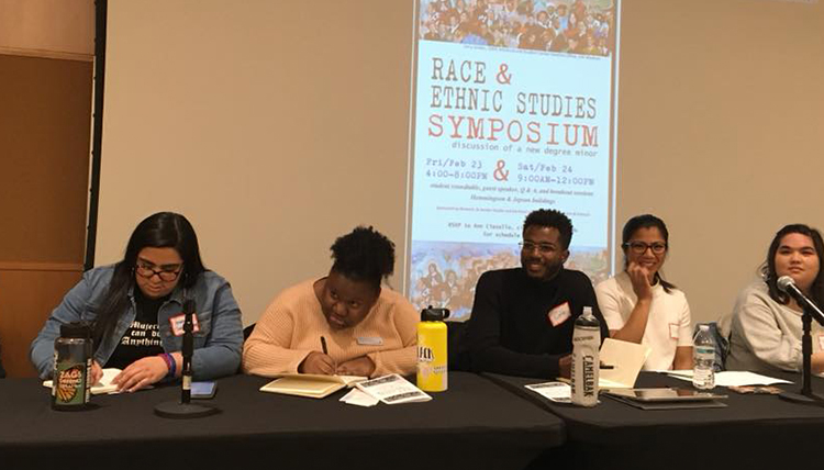 Students and alumni sit at panel at race and ethnic studies symposium