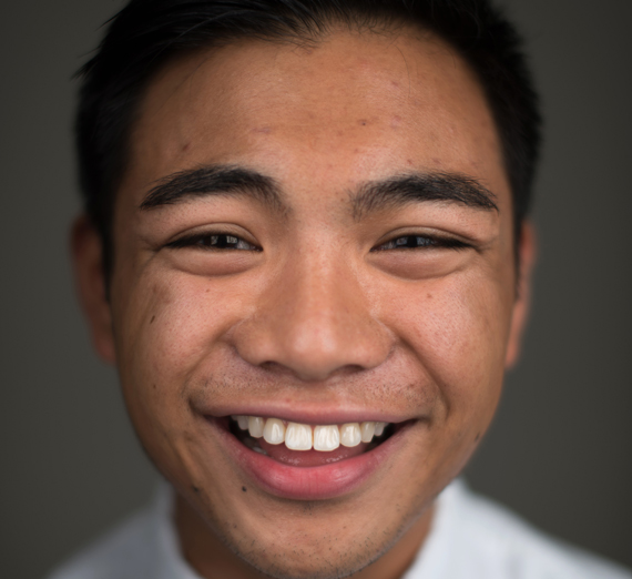 Profile of a smiling young Hispanic man