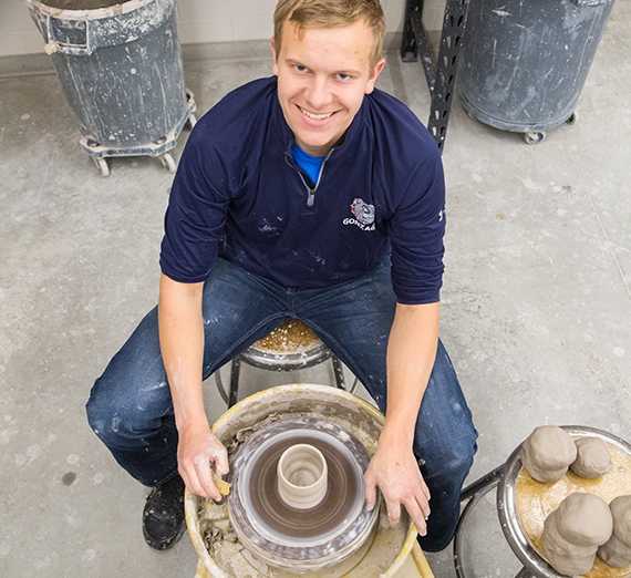  Scott Campbell, physics, mathematics & computer science major, throwing pottery.