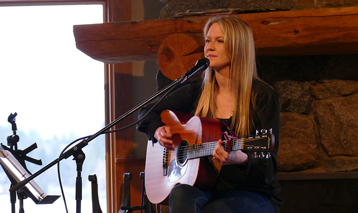 female singer songwriter Nicole Lewis with guitar