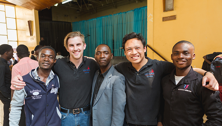 Gonzaga students and African music students pose smiling for a photo together