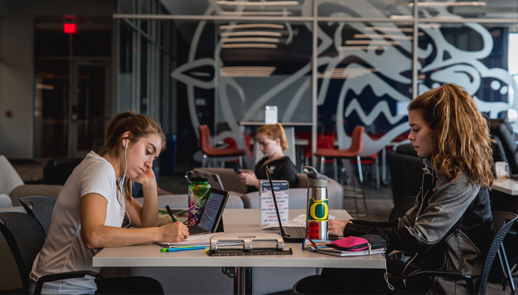 two female students study at Volkar Center for Athletic Achievement