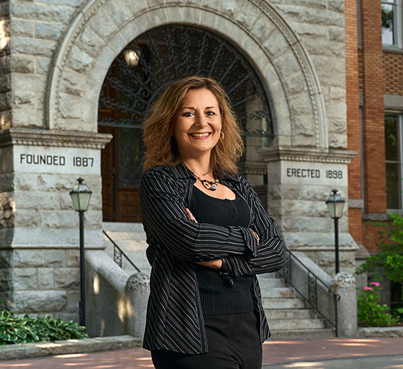 Gonzaga President Katia Passerini stands in fron of College Hall.